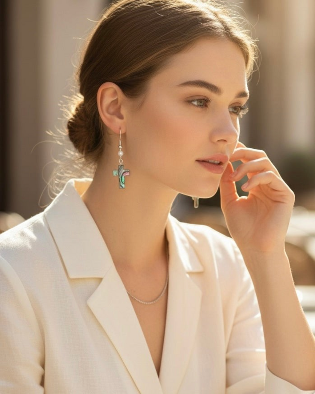 Amelia Jane Handmade Creations abalone shell cross earrings with freshwater pearl and S925 posts worn by a woman