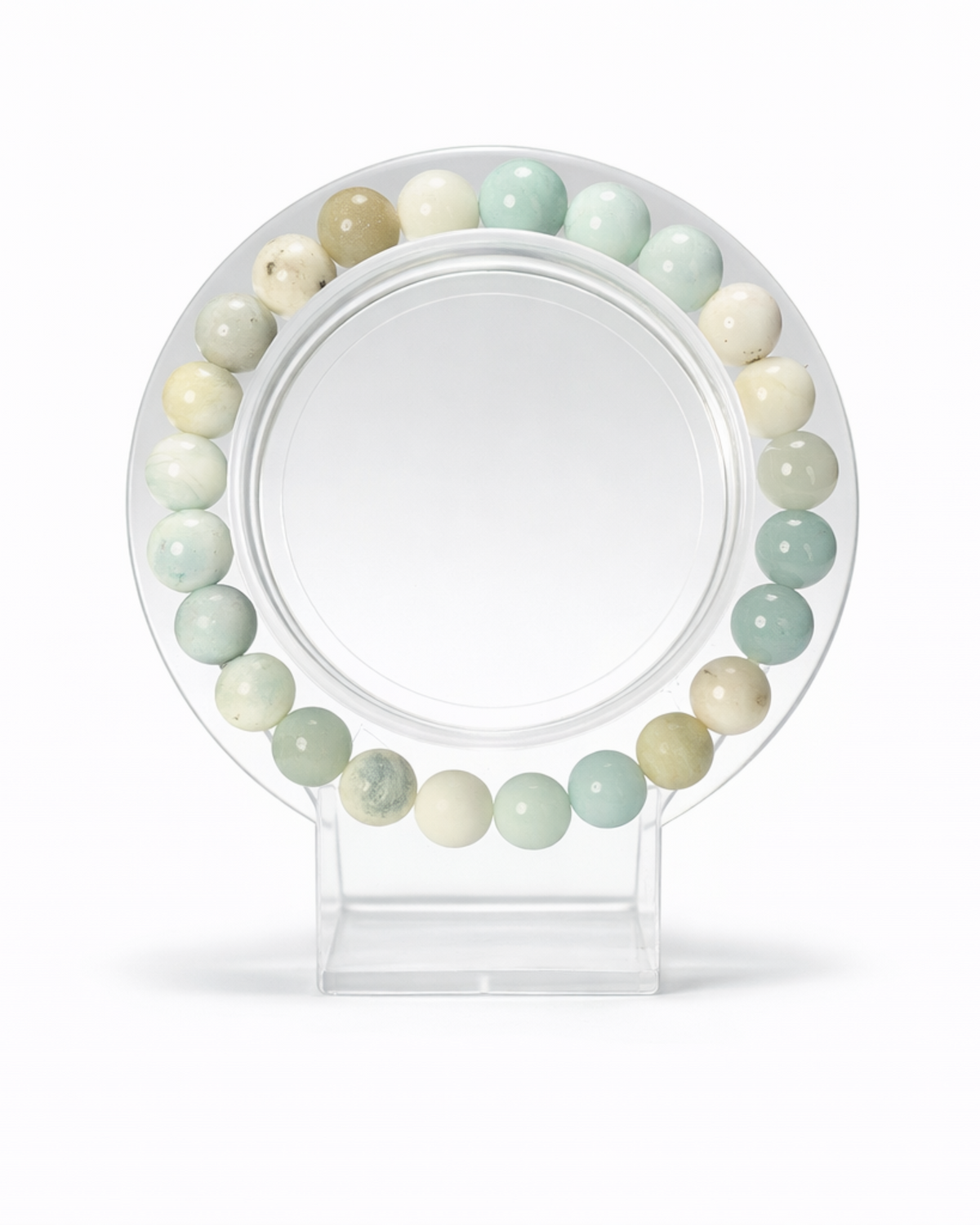 Amelia Jane Handmade Creations 7-inch Caribbean blue calcite beaded bracelet on a clear circular display stand