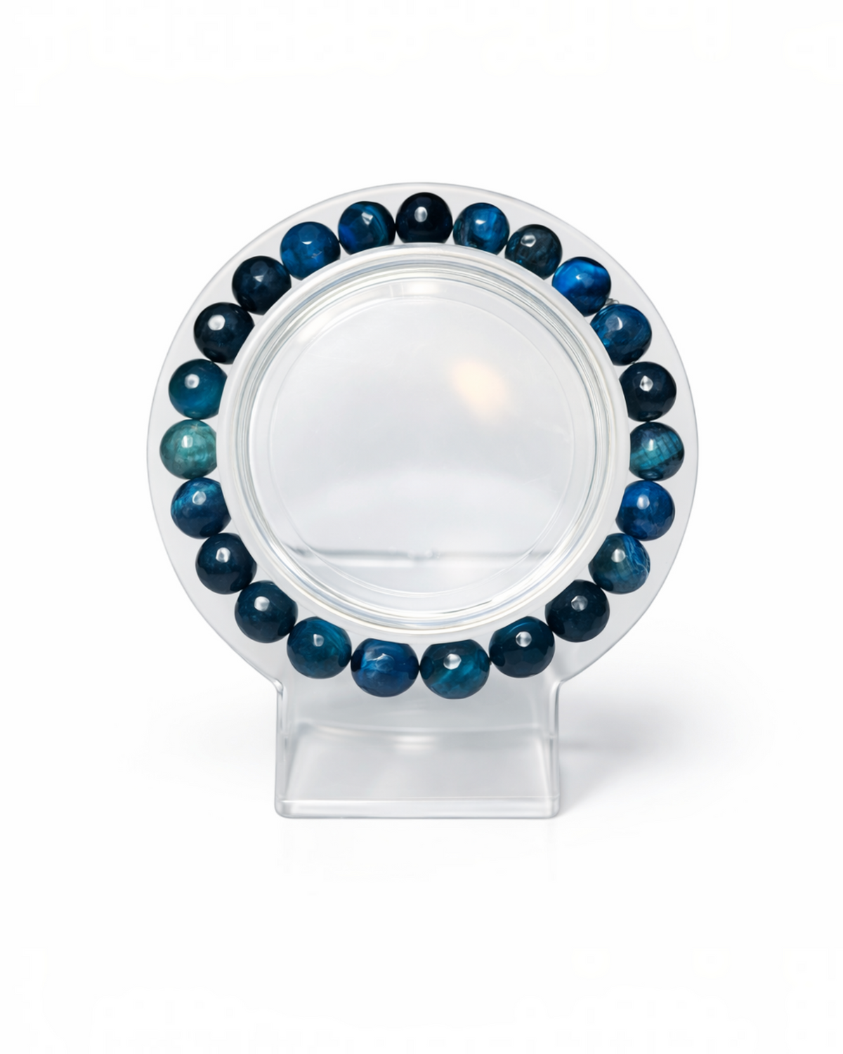 Amelia Jane Handmade Creations 7-inch faceted blue tiger's eye gemstone bead bracelet on a clear display stand.
