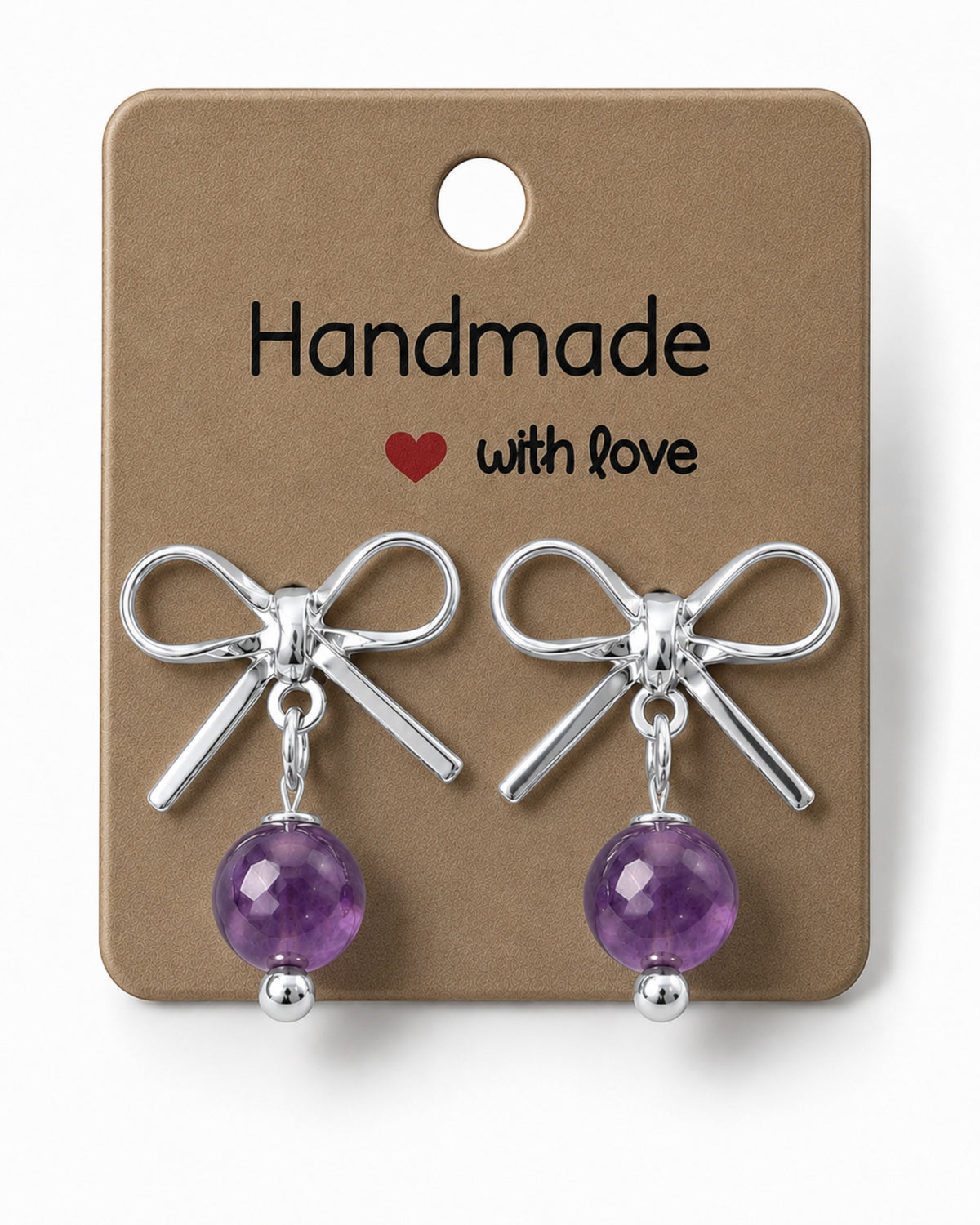 Amelia Jane Handmade Creations platinum plated bow stud earrings with dangling purple amethyst beads on display card.