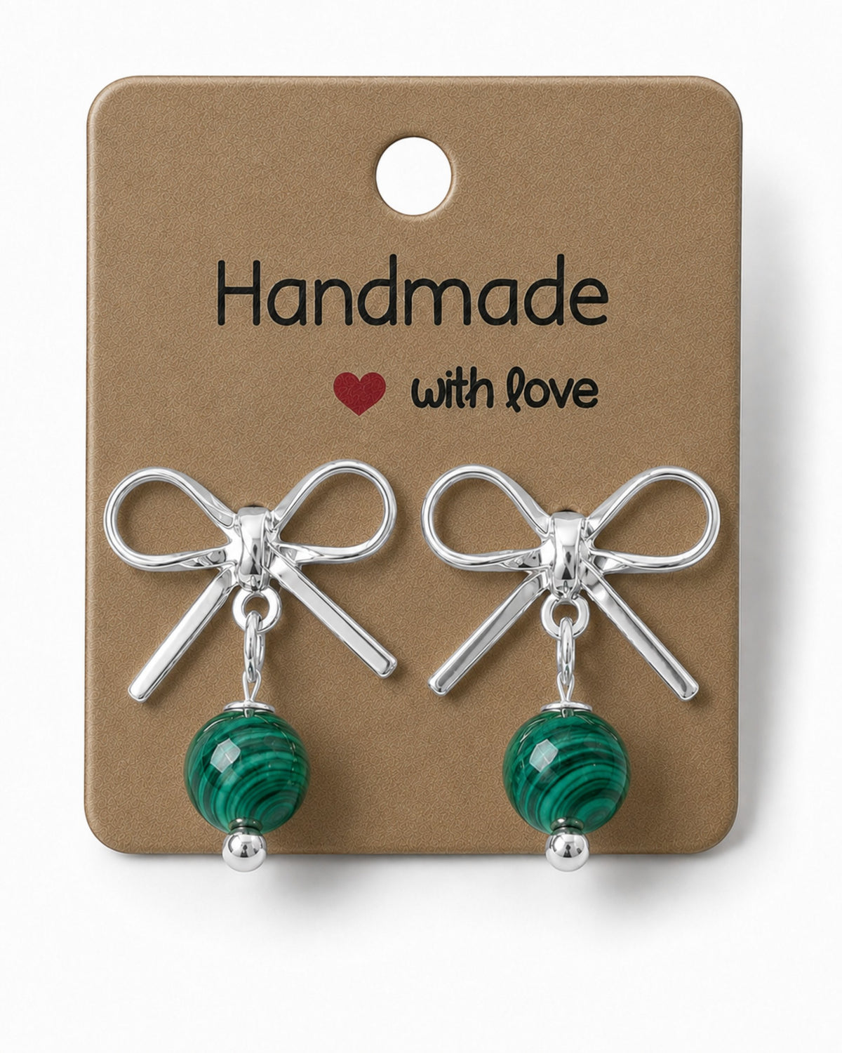 Amelia Jane Handmade Creations bow stud earrings with green malachite beads and platinum plated finish on display card