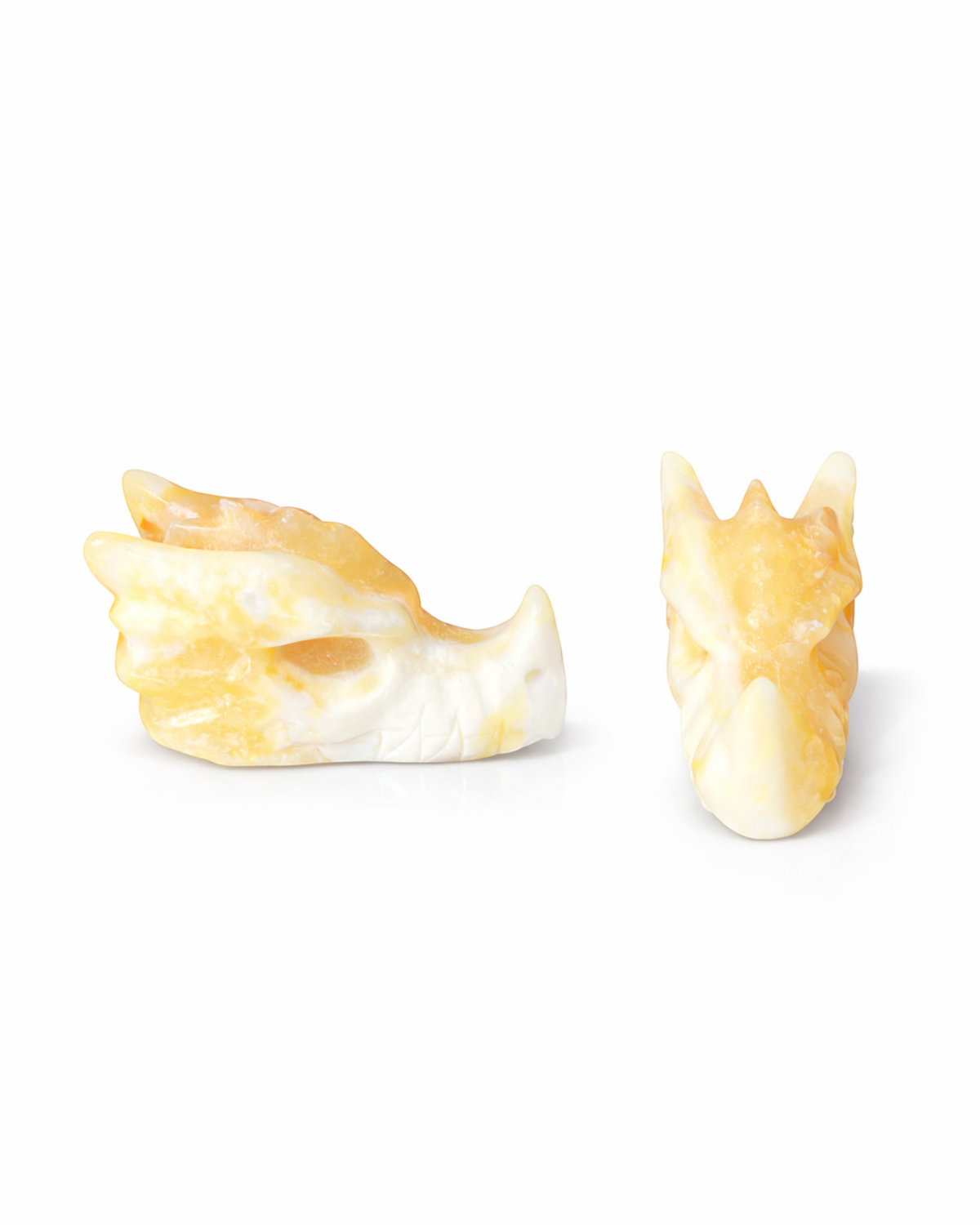 Amelia Jane Handmade Creations orange and white calcite dragon head carving with polished finish and intricate details.