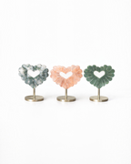 Amelia Jane Handmade Creations carved gemstone heart leaves in moss agate and fire quartz on gold metal stands.