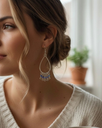 Amelia Jane Handmade Creations Ethiopian opal fringe earrings with S925 silver teardrop frames worn by a woman