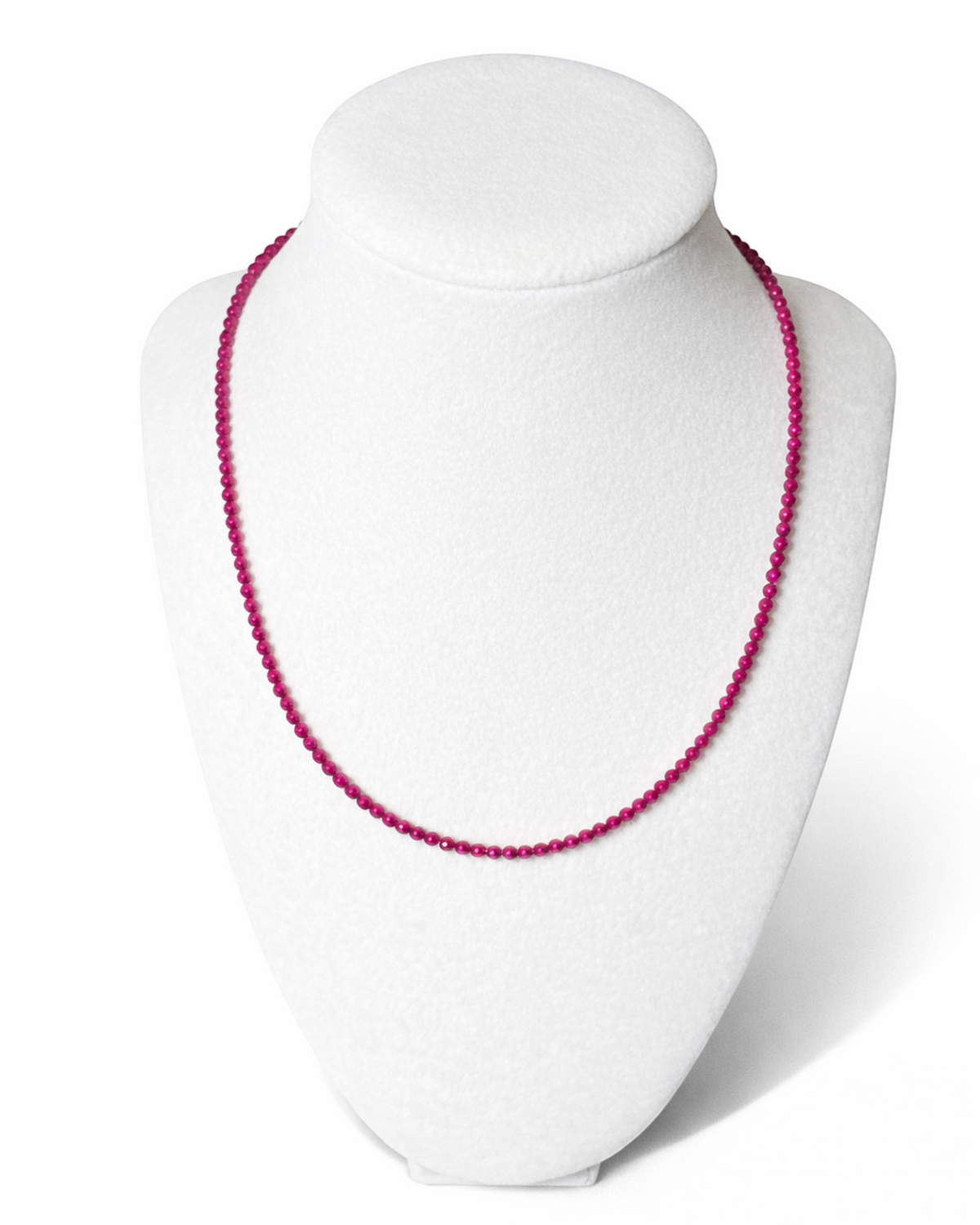 Amelia Jane Handmade Creations faceted ruby bead necklace on a white display bust