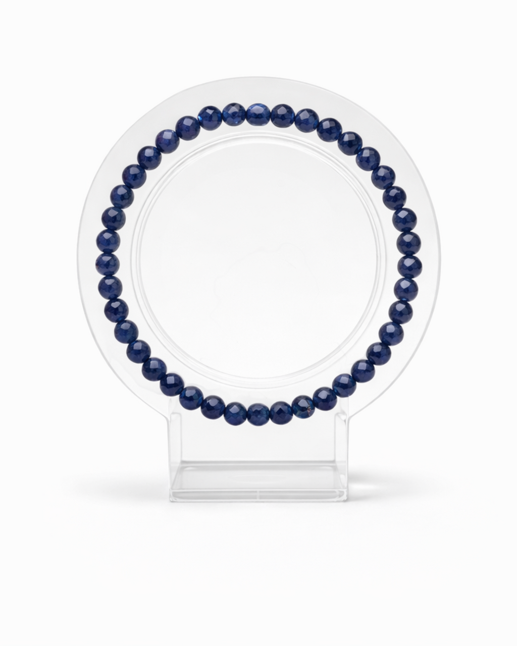 Amelia Jane Handmade Creations 7-inch faceted sodalite gemstone bead bracelet on a clear circular display stand