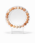 Amelia Jane Handmade Creations 7-inch flower agate beaded bracelet on a clear circular display stand