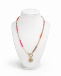 Amelia Jane Handmade Creations Summer Solstice necklace with multi-colored gemstone beads and a gold sunburst pendant.