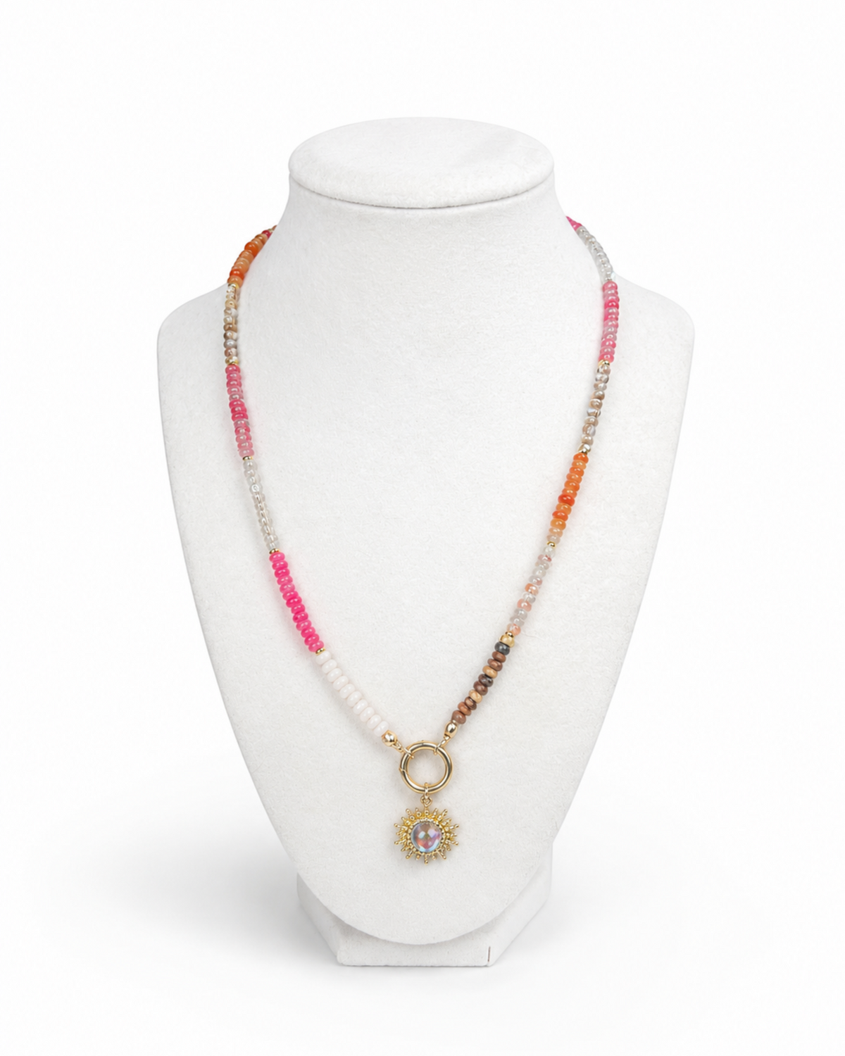 Amelia Jane Handmade Creations Summer Solstice necklace with multi-colored gemstone beads and a gold sunburst pendant.