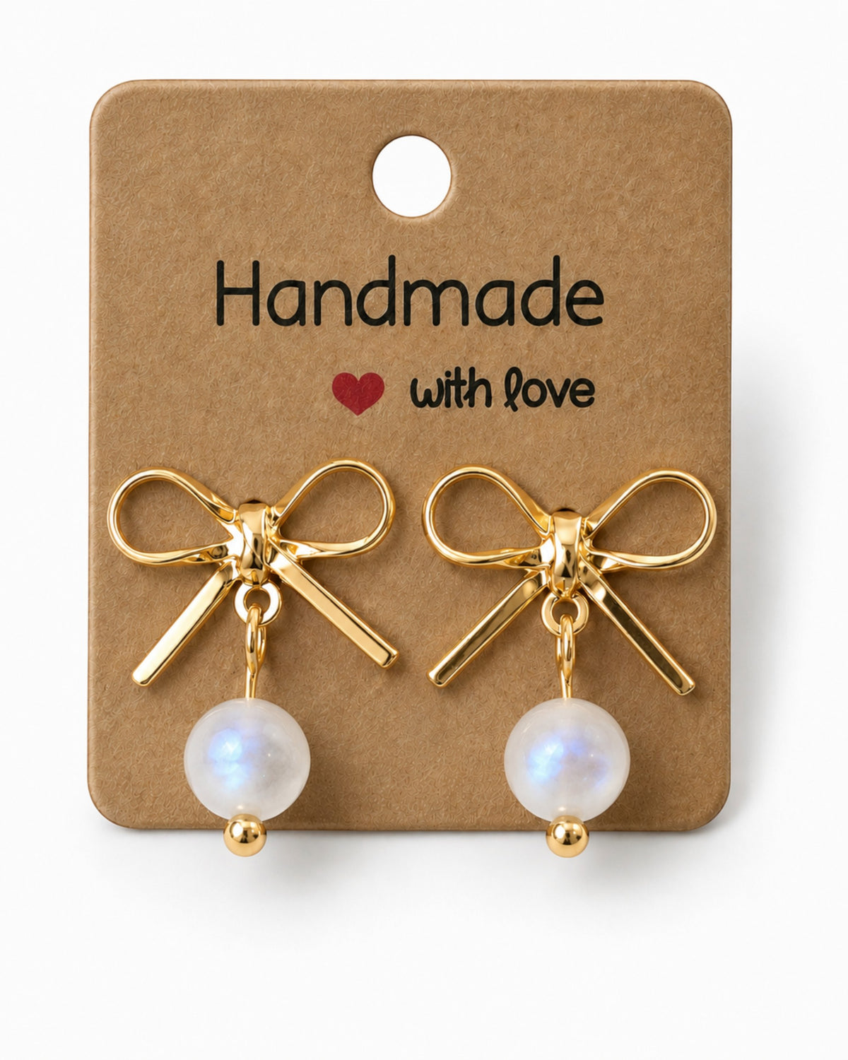 Amelia Jane Handmade Creations gold bow stud earrings with dangling iridescent beads on a handmade display card.