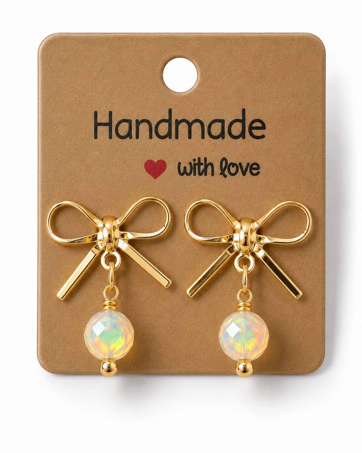 Amelia Jane Handmade Creations gold plated bow stud earrings with dangling iridescent beads on a display card.