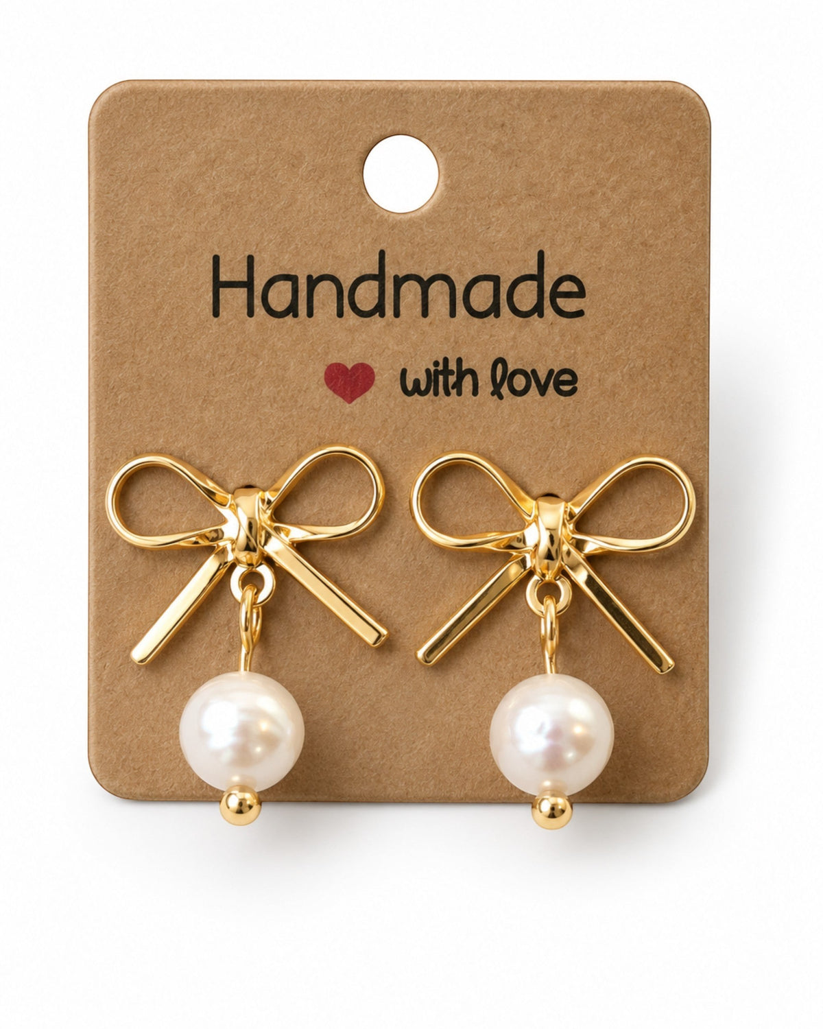 Amelia Jane Handmade Creations gold plated bow stud earrings with dangling white pearls on a handmade display card.