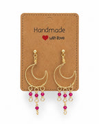 Amelia Jane Handmade Creations wire wrapped gold moon earrings with pink beaded dangles and s925 posts on display card