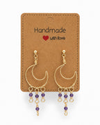 Amelia Jane Handmade Creations wire wrapped gold crescent moon earrings with purple crystal dangles and s925 posts