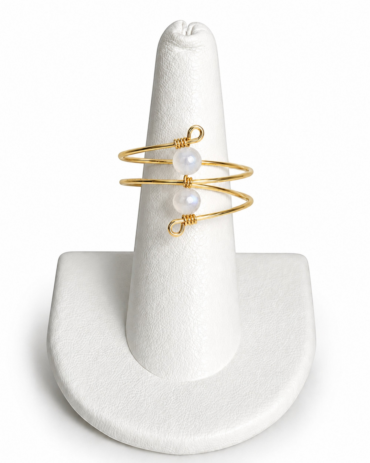 Amelia Jane Handmade Creations gold wire wrap ring featuring two delicate moonstone beads on a white display stand