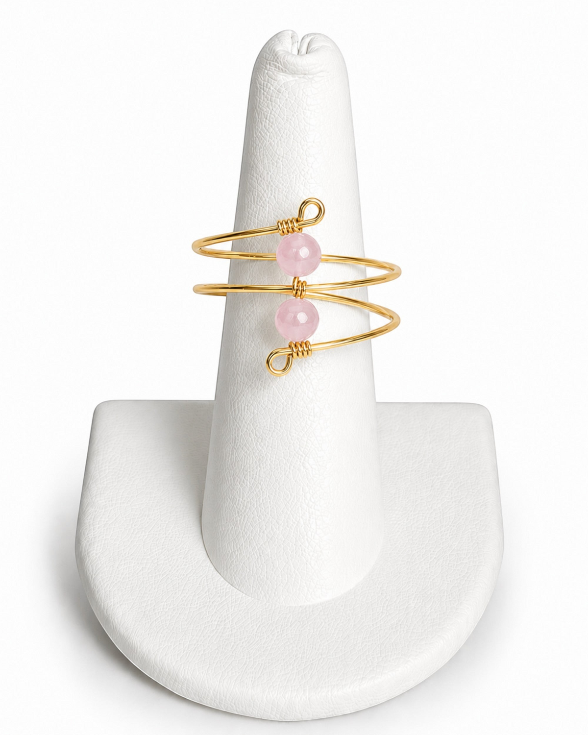 Amelia Jane Handmade Creations gold wire wrap ring featuring two faceted pink rose quartz beads on a white display