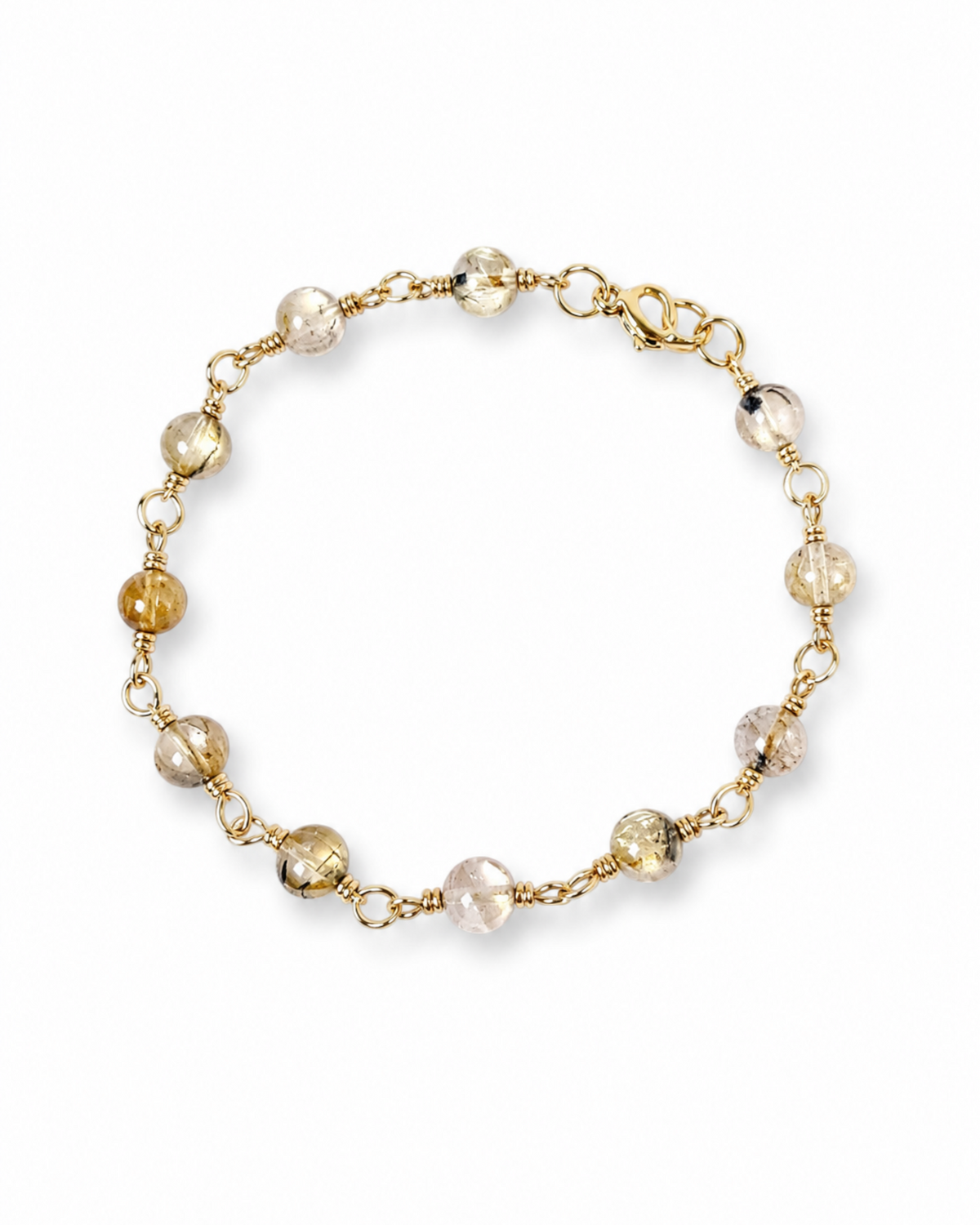 Amelia Jane Handmade Creations 7-inch station bracelet featuring round golden rutile quartz beads and gold wire links.