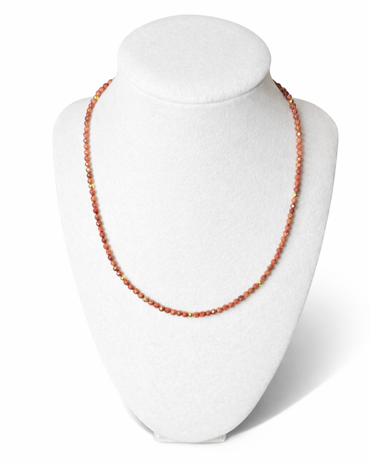 Amelia Jane Handmade Creations faceted goldstone and gold hematite beaded necklace on a white display bust