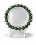 Amelia Jane Handmade Creations 7-inch green jade beaded bracelet on a clear circular display stand
