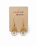 Amelia Jane Handmade Creations green tourmaline teardrop earrings with gold wire filigree and s925 posts on a card.