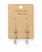 Amelia Jane Handmade Creations freshwater pearl dangle earrings with S925 silver posts on a kraft display card.