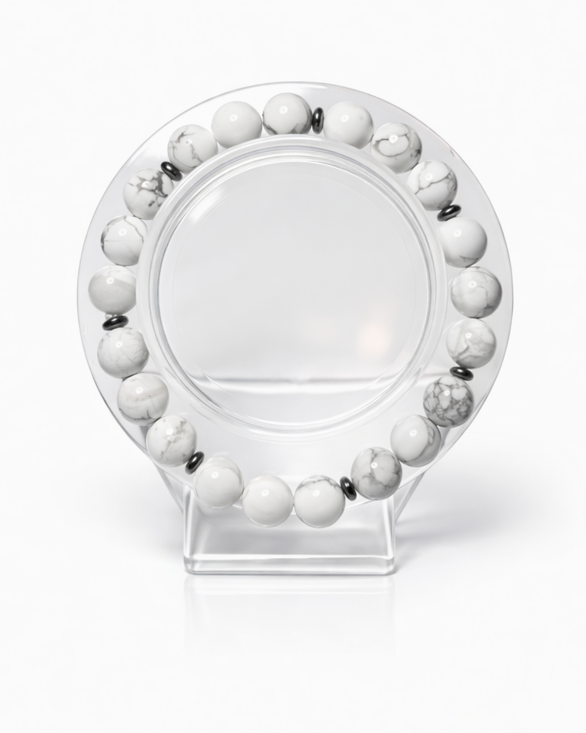 Amelia Jane Handmade Creations 7-inch beaded bracelet featuring white marbled howlite and metallic hematite stones.