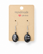 Amelia Jane Handmade Creations hypersthene oval drop earrings with S925 silver posts on a handmade display card.