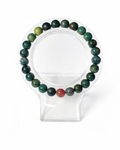 Amelia Jane Handmade Creations 7-inch Indian Agate beaded bracelet featuring green and earthy tones on a clear stand.