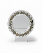 Amelia Jane Handmade Creations 7-inch labradorite beaded bracelet with grey iridescent gemstone spheres on a stand