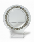Amelia Jane Handmade Creations 7-inch beaded bracelet featuring round grey labradorite gemstones on a clear stand.