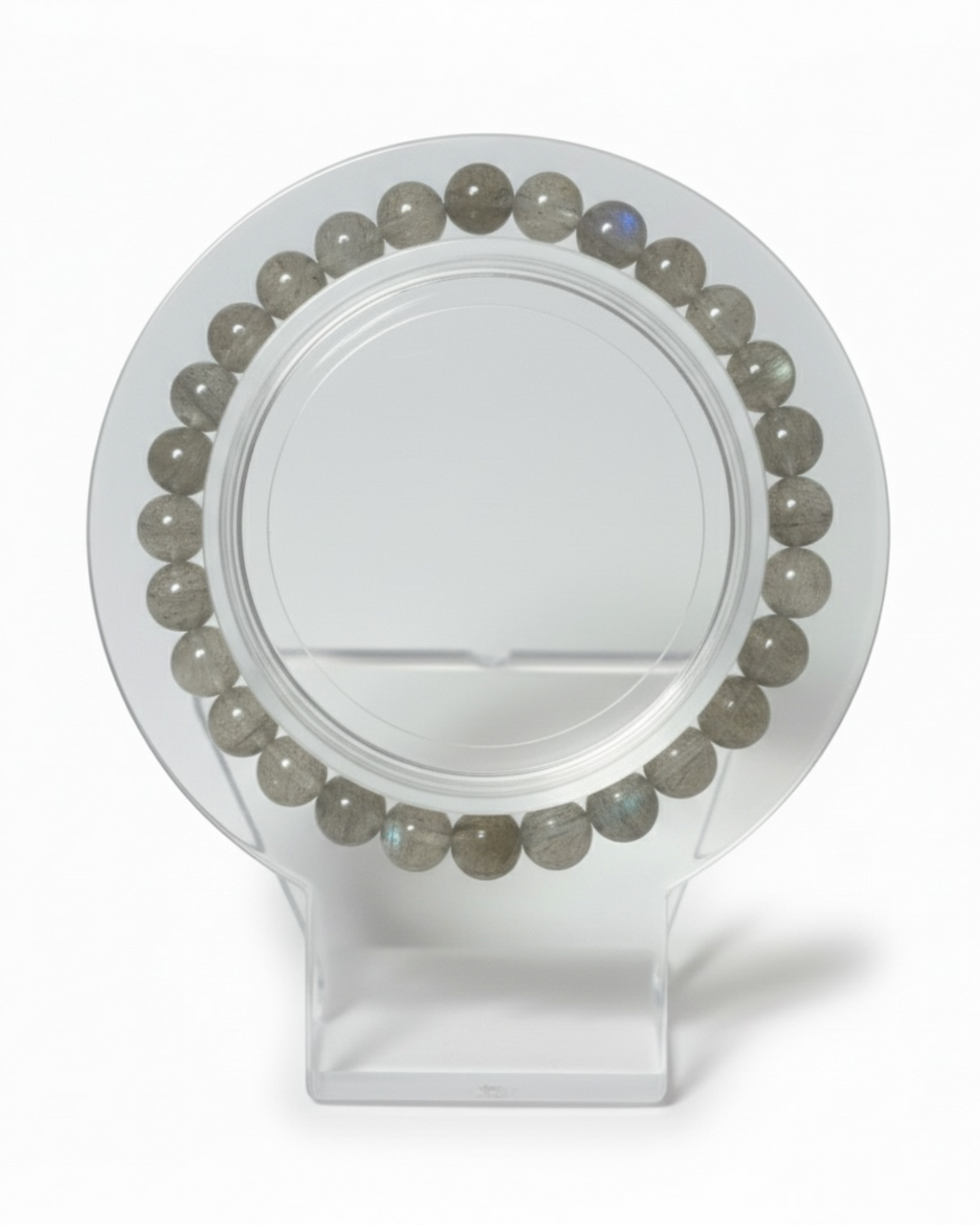 Amelia Jane Handmade Creations 7-inch beaded bracelet featuring round grey labradorite gemstones on a clear stand.
