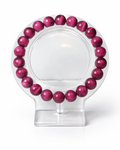Amelia Jane Handmade Creations 7-inch magenta tiger's eye beaded bracelet on a clear display stand