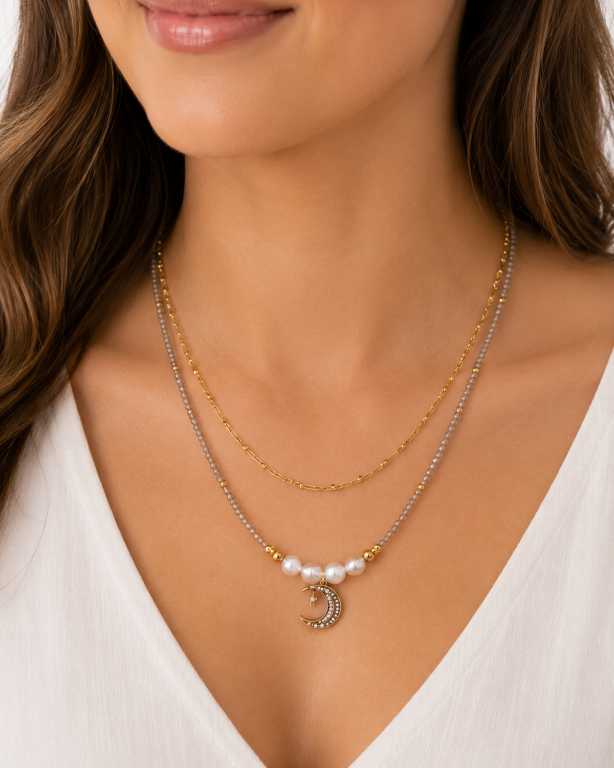 Amelia Jane Handmade Creations Moonlit Mist necklace featuring a gold crescent moon pendant with pearls and beads.