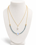 Amelia Jane Handmade Creations Moonlit Tides necklace with 14k gold filled chain, blue topaz, moonstone, and pearl.