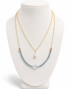 Amelia Jane Handmade Creations Moonlit Tides necklace with 14k gold filled chain, blue topaz, moonstone, and pearl.