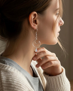 Amelia Jane Handmade Creations moonstone moon earrings with S925 silver posts worn by a woman in profile