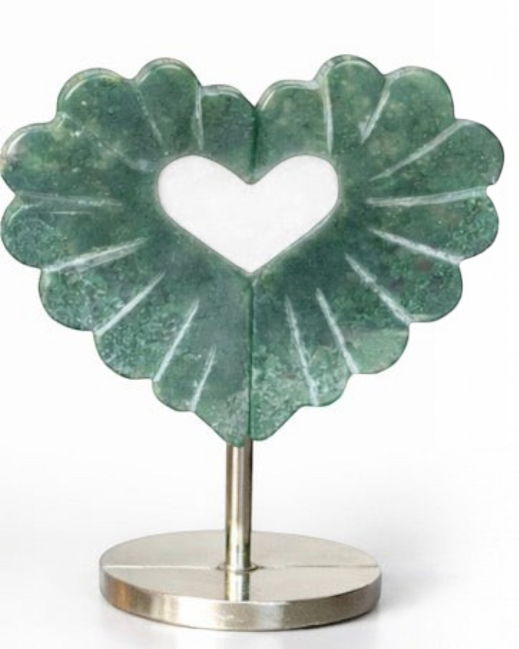 Amelia Jane Handmade Creations moss agate heart leaf carving with intricate details on a sleek metal display stand