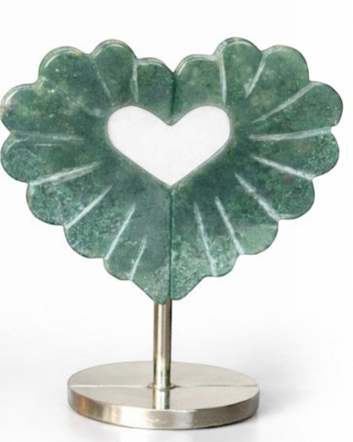 Amelia Jane Handmade Creations moss agate heart leaf carving with intricate details on a sleek metal display stand