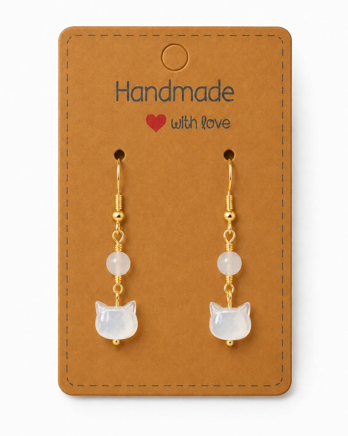 Amelia Jane Handmade Creations mother of pearl kitty cat earrings with s925 gold-toned posts on a display card