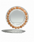Amelia Jane Handmade Creations 7-inch peach moonstone beaded bracelet on a clear circular display stand.