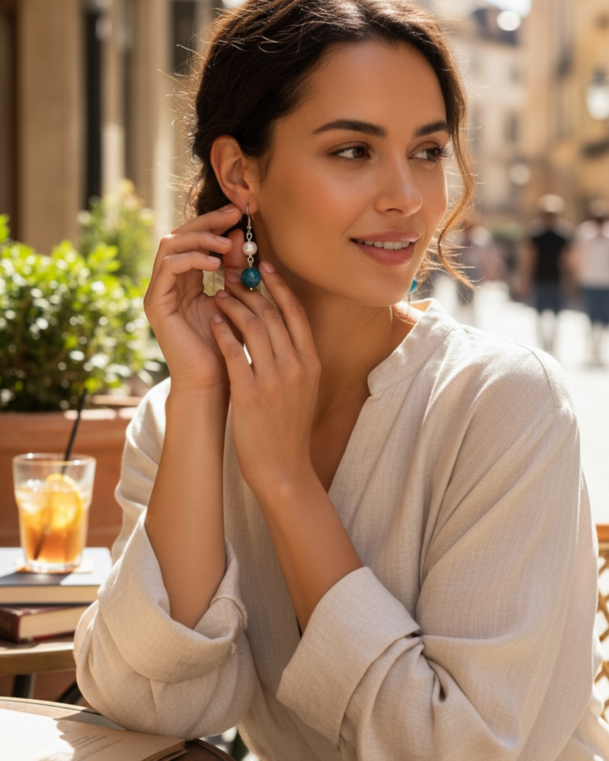 Amelia Jane Handmade Creations freshwater pearl and blue apatite drop earrings with S925 posts worn by a woman