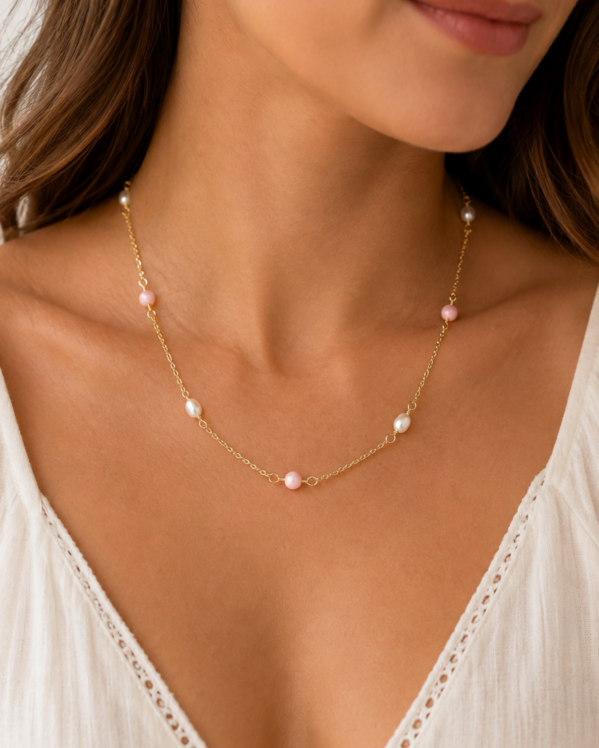 Amelia Jane Handmade Creations 18-inch station necklace featuring pink conch beads and white freshwater pearls