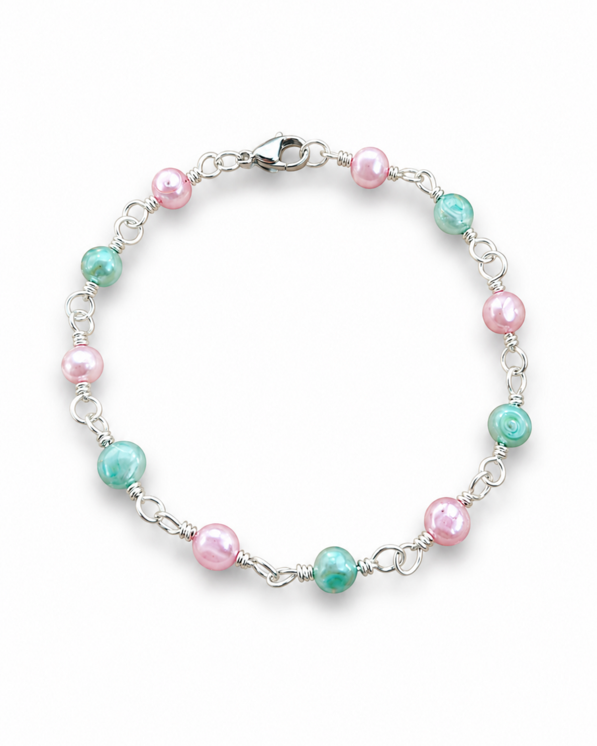 Amelia Jane Handmade Creations 7-inch station bracelet featuring alternating pink and teal freshwater pearls on silver