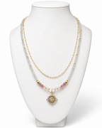 Amelia Jane Handmade Creations Pink Horizons necklace featuring aquamarine, pink tourmaline, and gold filled chain.