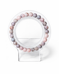 Amelia Jane Handmade Creations 7-inch Pink Zebra Jasper beaded bracelet on a clear acrylic display stand.