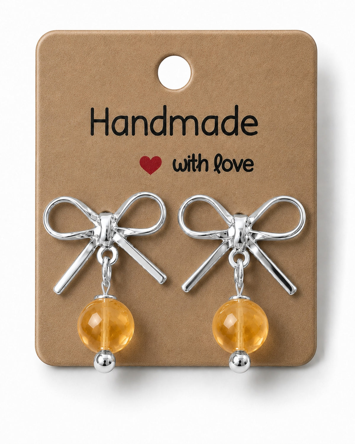 Amelia Jane Handmade Creations platinum plated bow stud earrings with dangling yellow crystal beads on display card