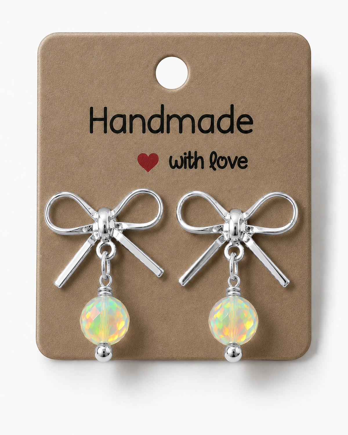 Amelia Jane Handmade Creations platinum plated bow stud earrings with iridescent crystal beads on a display card.