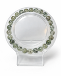 Amelia Jane Handmade Creations 7-inch beaded bracelet featuring translucent green prehnite stones with black inclusions