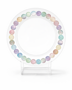 Amelia Jane Handmade Creations 7-inch rainbow selenite beaded bracelet on a clear circular display stand