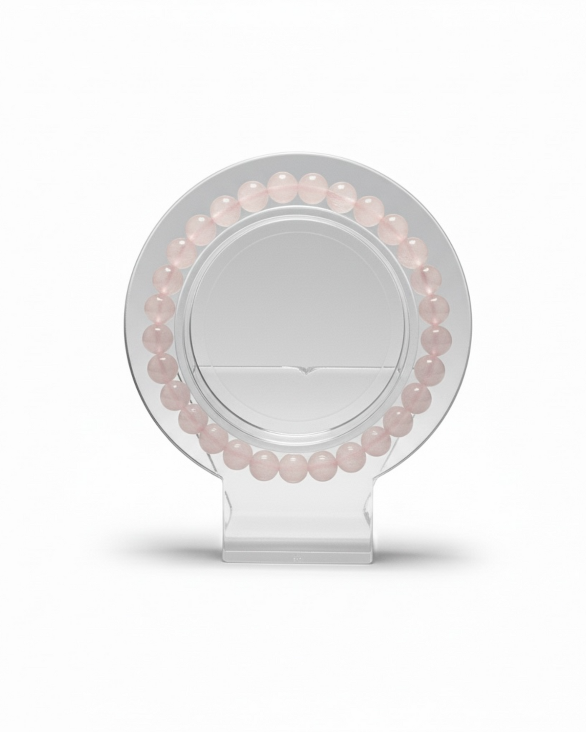 Amelia Jane Handmade Creations 7-inch rose quartz beaded bracelet displayed on a clear circular stand